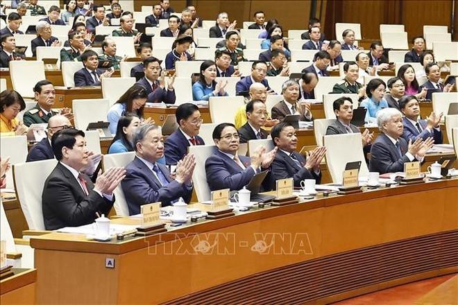 Party General Secretary To Lam (second, left), other Party and State leaders, and NA deputies attend the opening session. (Photo: VNA)