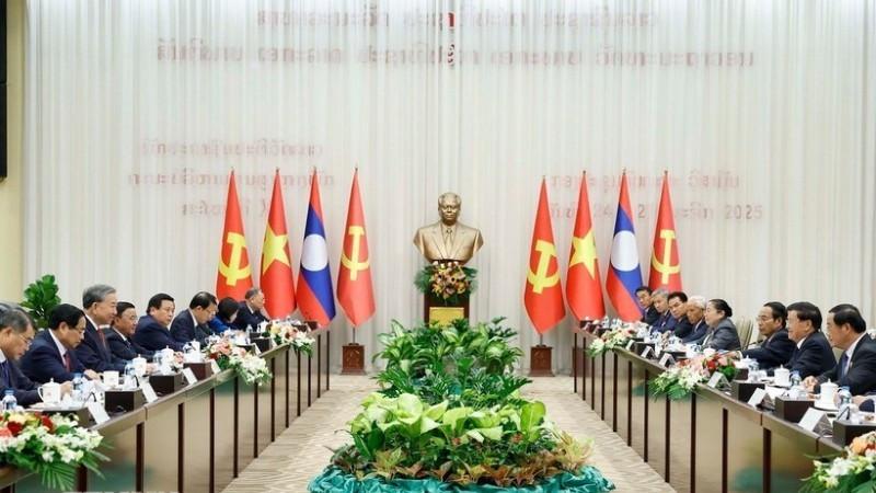 General Secretary To Lam and General Secretary and President of Laos Thongloun Sisoulith co-chaired the high-level meeting between the CPV and the LPRP. (Photo: Thong Nhat/VNA)