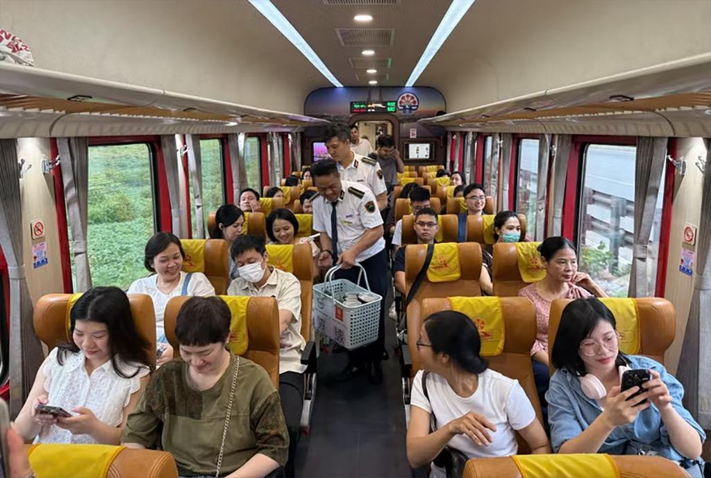 Railway officials, workers and employees conduct a trial run of the Ha Noi Phu Ly train service ahead of its official launch.