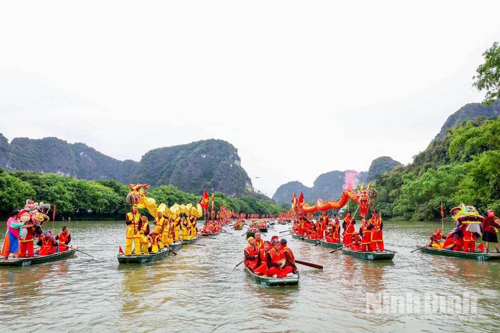 A distinctive dragon boat procession on the river at the festival.