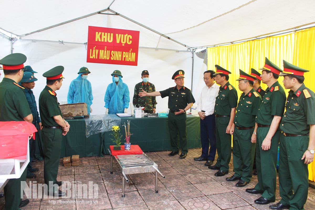 Taking bilogical samples for unidentified martyr's remains at Le ho ward martyr cemetery.
