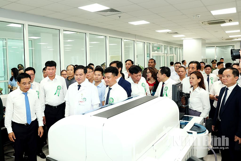 Delegates visit a room at the new campus.