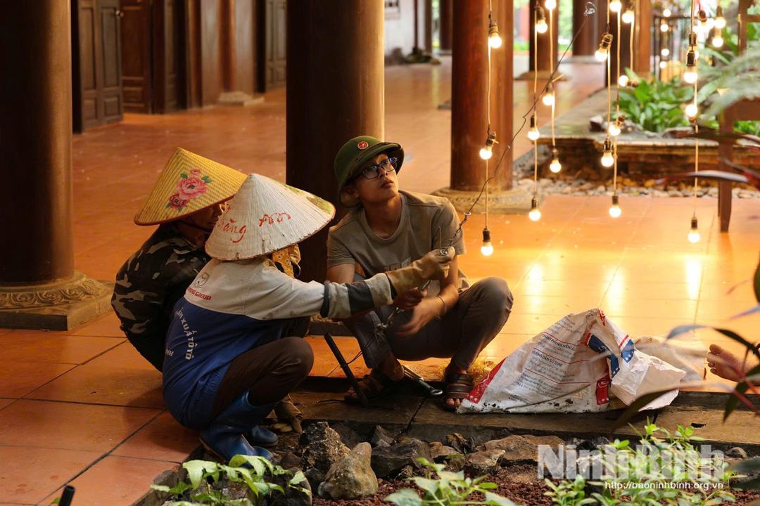 Staff at Trang An Ecological site inspect electricity system to ensure safety during rainy season.